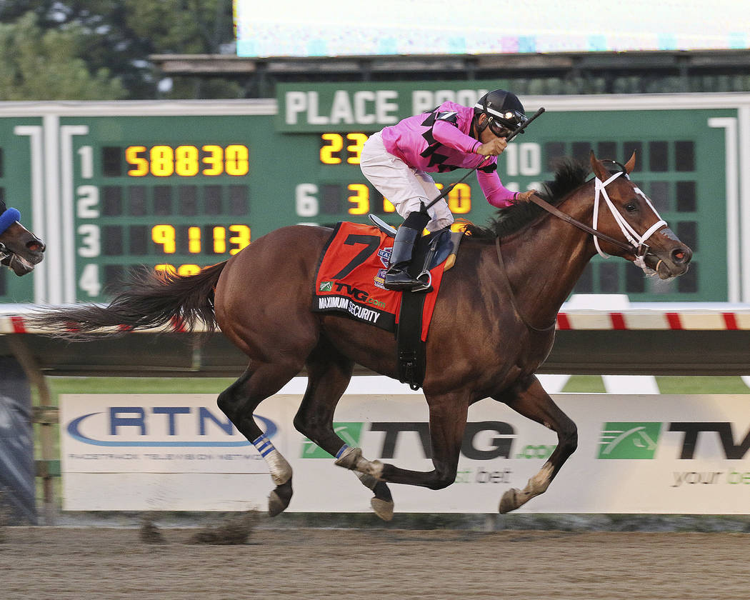 In this image provided by Ryan Denver/EQUI-PHOTO, Inc., Maximum Security (7), ridden by Luis Sa ...