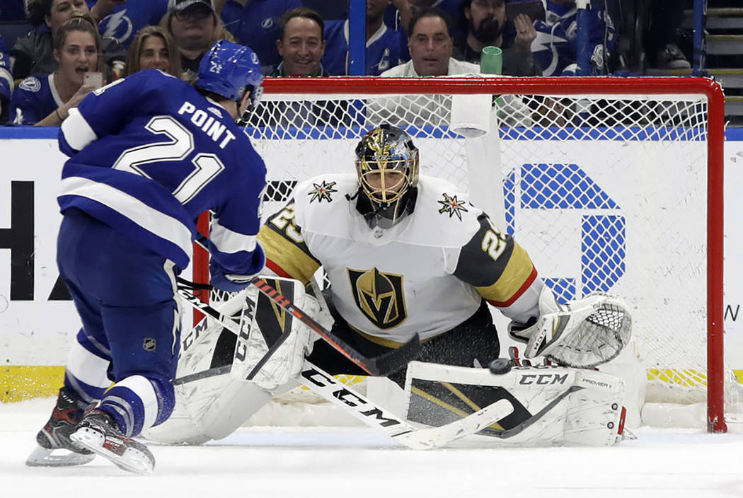 Vegas Golden Knights goaltender Marc-Andre Fleury (29) stops a shot by Tampa Bay Lightning cent ...