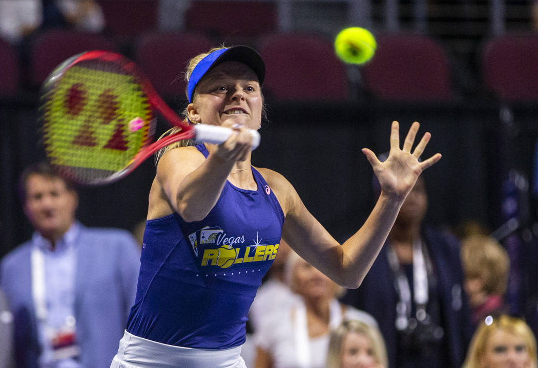 The Vegas Rollers' Harriet Dart returns a ball over the net during her mixed doubles set versus ...