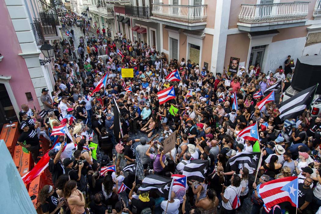 Demonstrators protest against Gov. Ricardo Rossello in San Juan, Puerto Rico, Sunday, July 21, ...