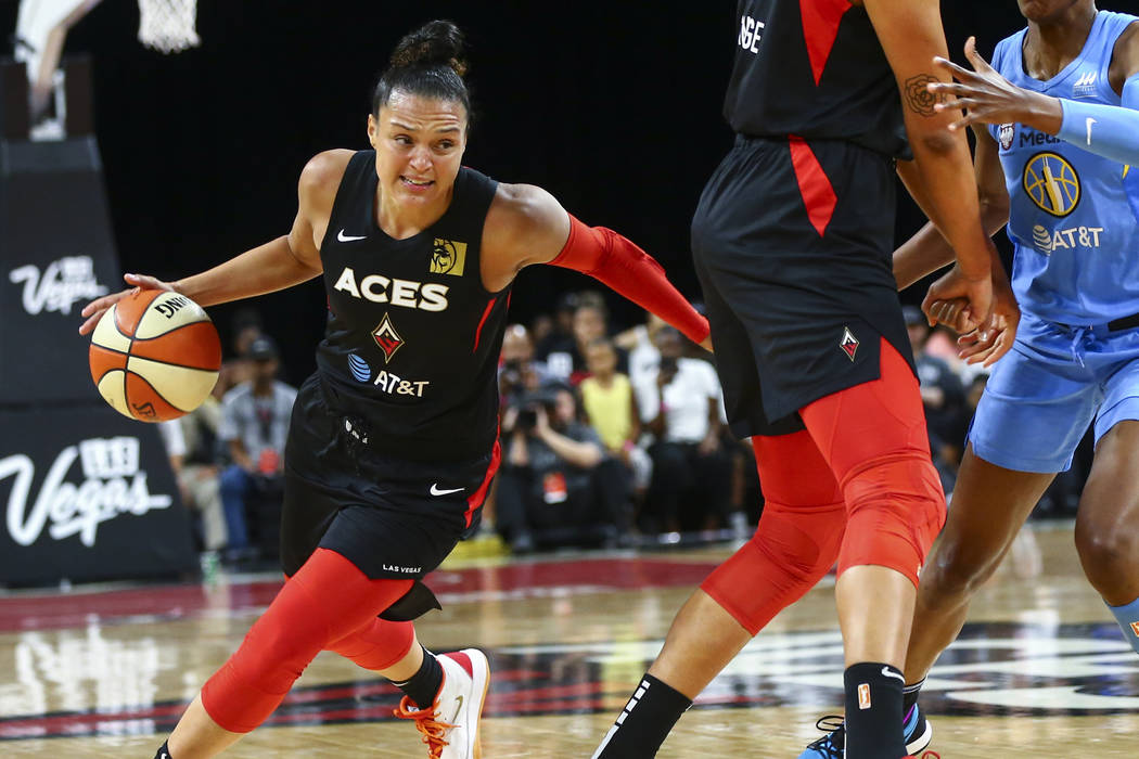 Las Vegas Aces' Kayla McBride (21) moves the ball against Chicago Sky during the first half of ...