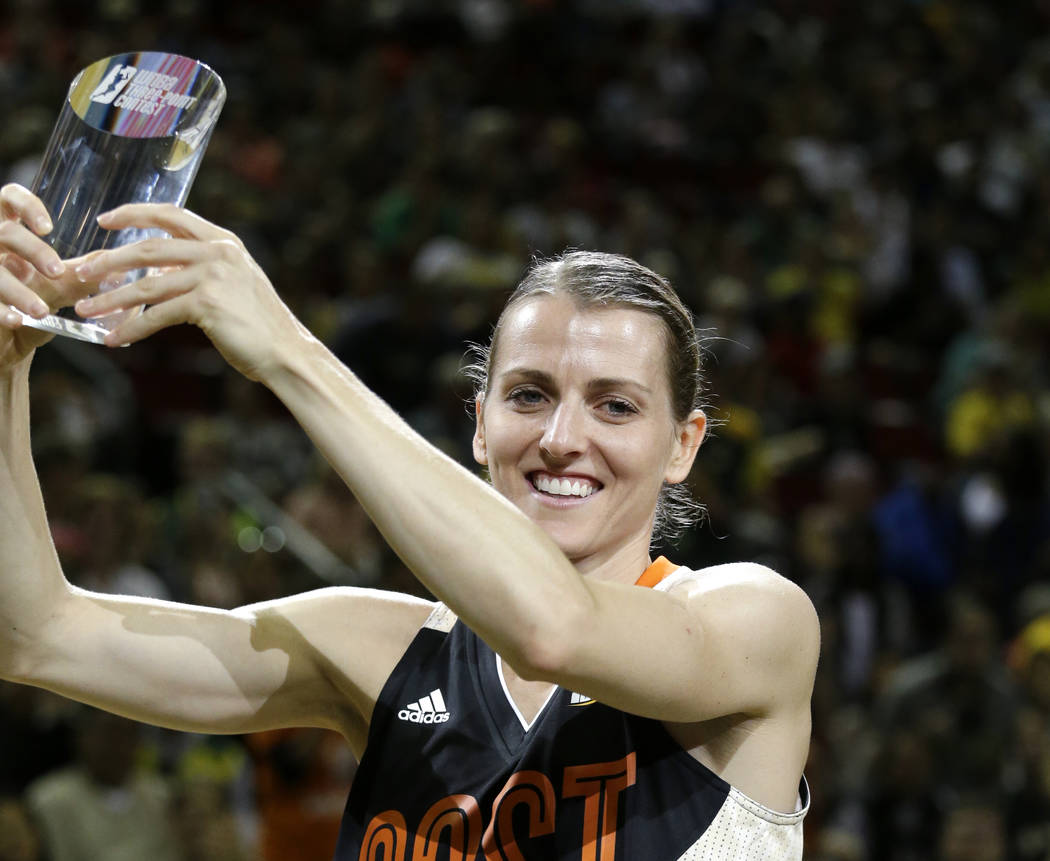 Chicago Sky's Allie Quigley holds up the trophy after winning the three-point contest at the WN ...