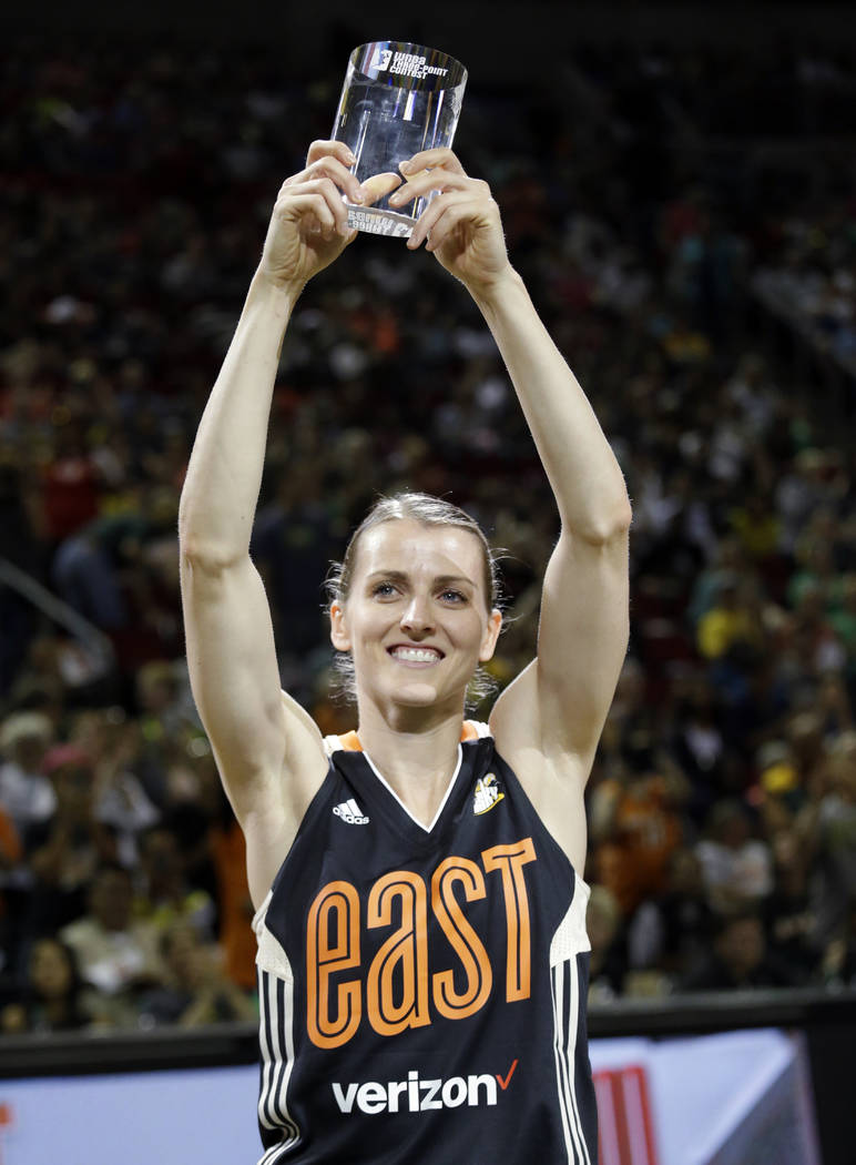 Chicago Sky's Allie Quigley holds up the trophy after winning the three-point contest at the WN ...