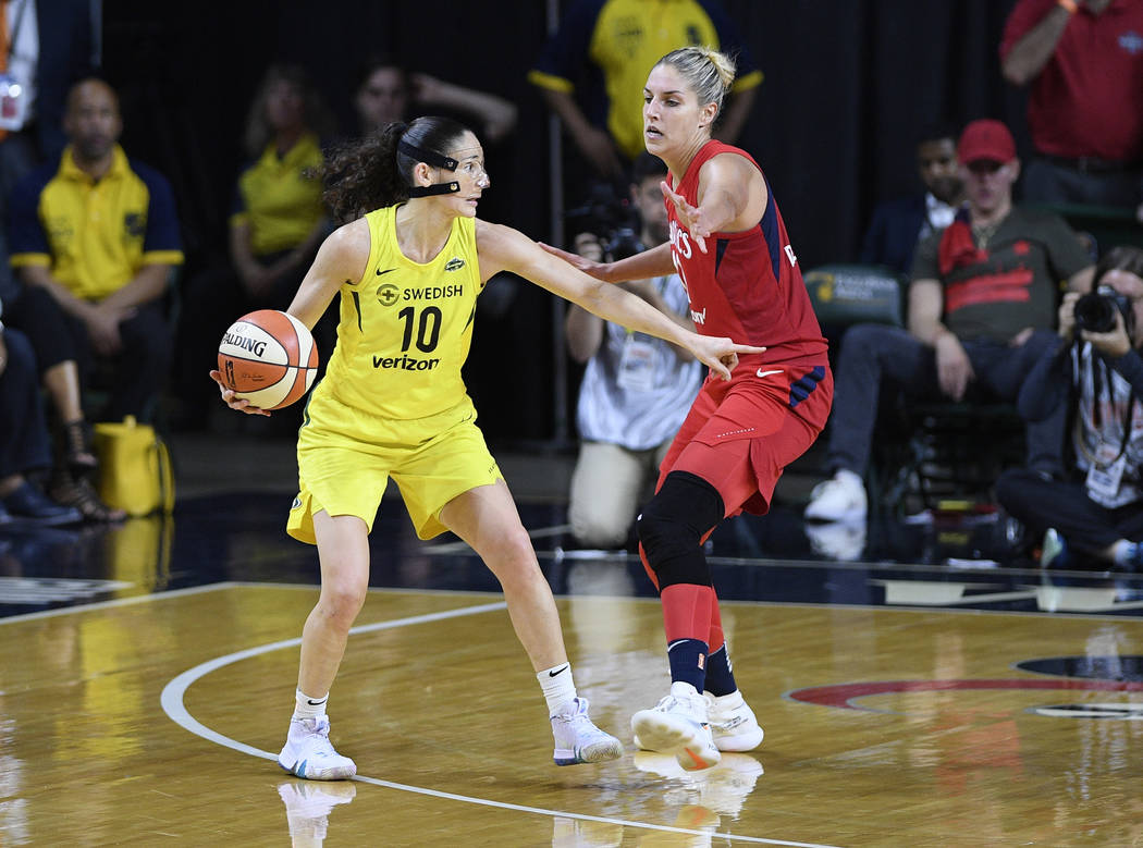 Seattle Storm guard Sue Bird (10) dribbles against Washington Mystics forward Elena Delle Donne ...