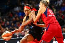 Las Vegas Aces center A'ja Wilson (22) moves the ball around Washington Mystics forward Elena D ...