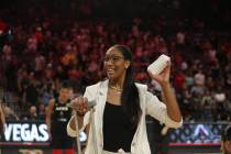 Las Vegas Aces forward A'ja Wilson throws T-shirts into the crowds of fans after the WNBA baske ...