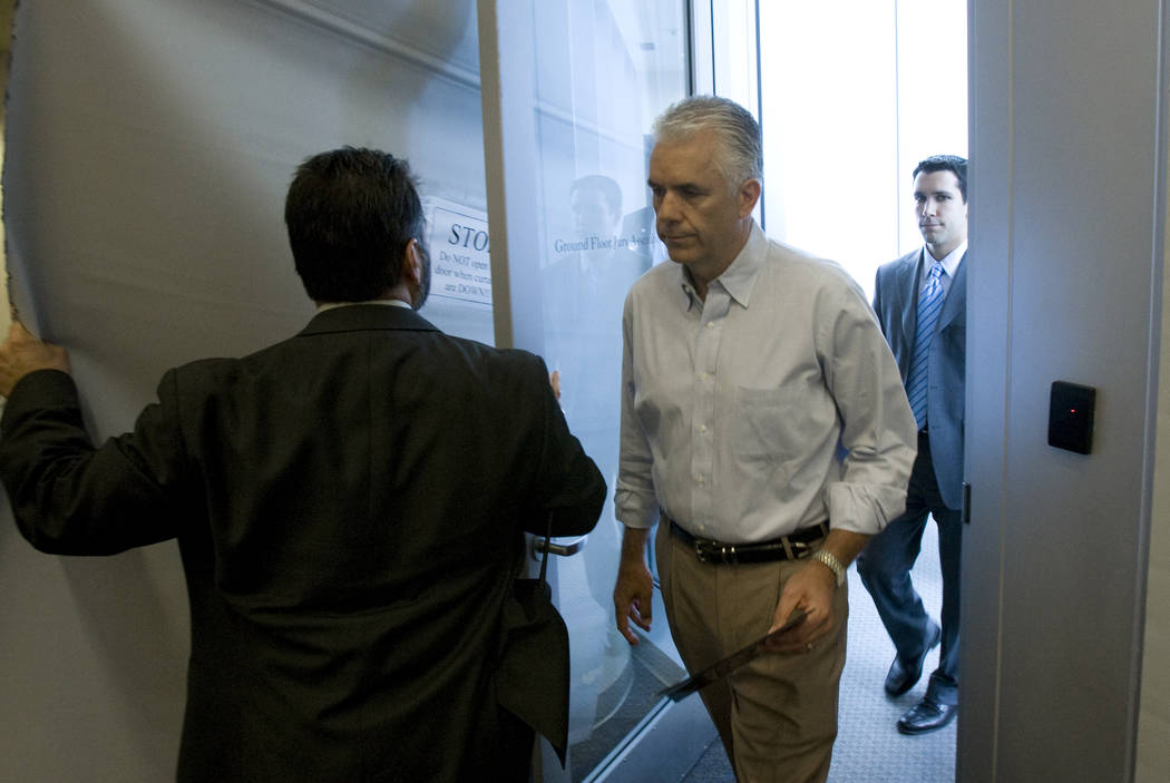 Sen. John Ensign, R-Nev., enters through a side door at the Lloyd George U.S. Courthouse in Las ...