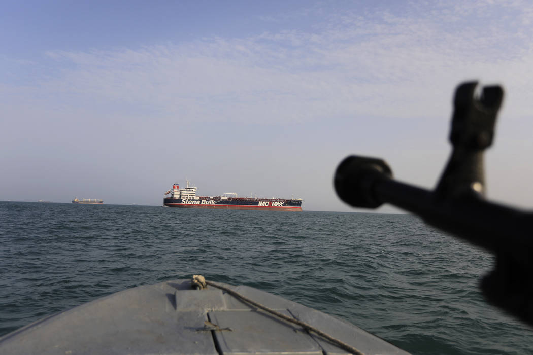 In this Sunday, July 21, 2019 photo, a speedboat of Iran's Revolutionary Guard trains a weapon ...