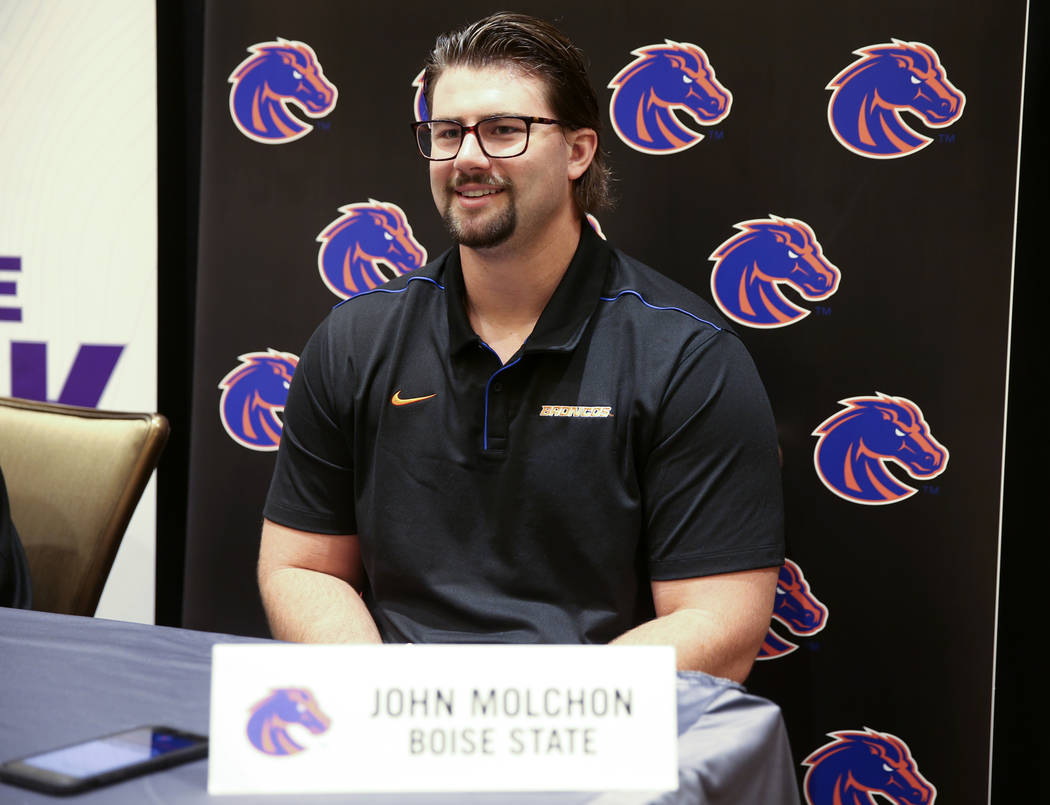 Boise State offensive lineman John Molchon talks to reporters during Mountain West football med ...