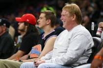 Oakland Raiders owner Mark Davis reacts while attending during the first half of a WNBA basketb ...