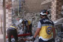 This photo provided by the Syrian Civil Defense White Helmets, which has been authenticated bas ...
