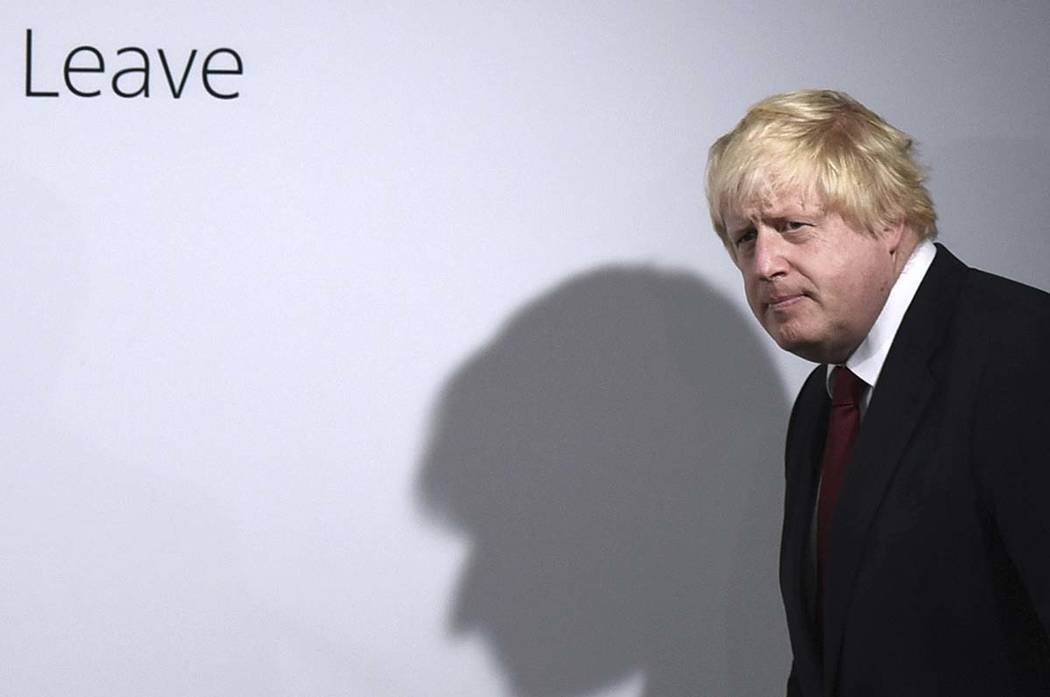 In a Friday, June 24, 2016, file photo, Vote Leave campaigner Boris Johnson arrives for a press ...
