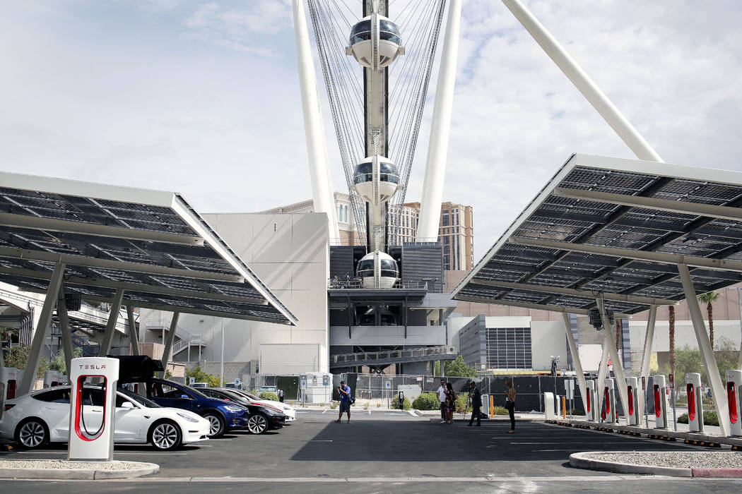 Teslas are charging at Tesla's largest Supercharger station now open near the High Roller in La ...