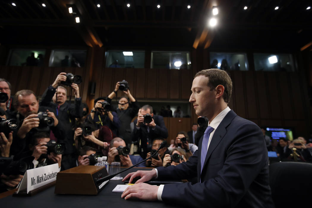 FILE - In this April 10, 2018, file photo Facebook CEO Mark Zuckerberg takes his seat to testif ...