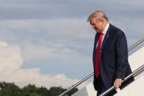 President Donald Trump disembarks Air Force One upon arrival at Wheeling, W.Va., Wednesday, Jul ...