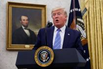 President Donald Trump speaks during a ceremony in the Oval Office of the White House where Mar ...