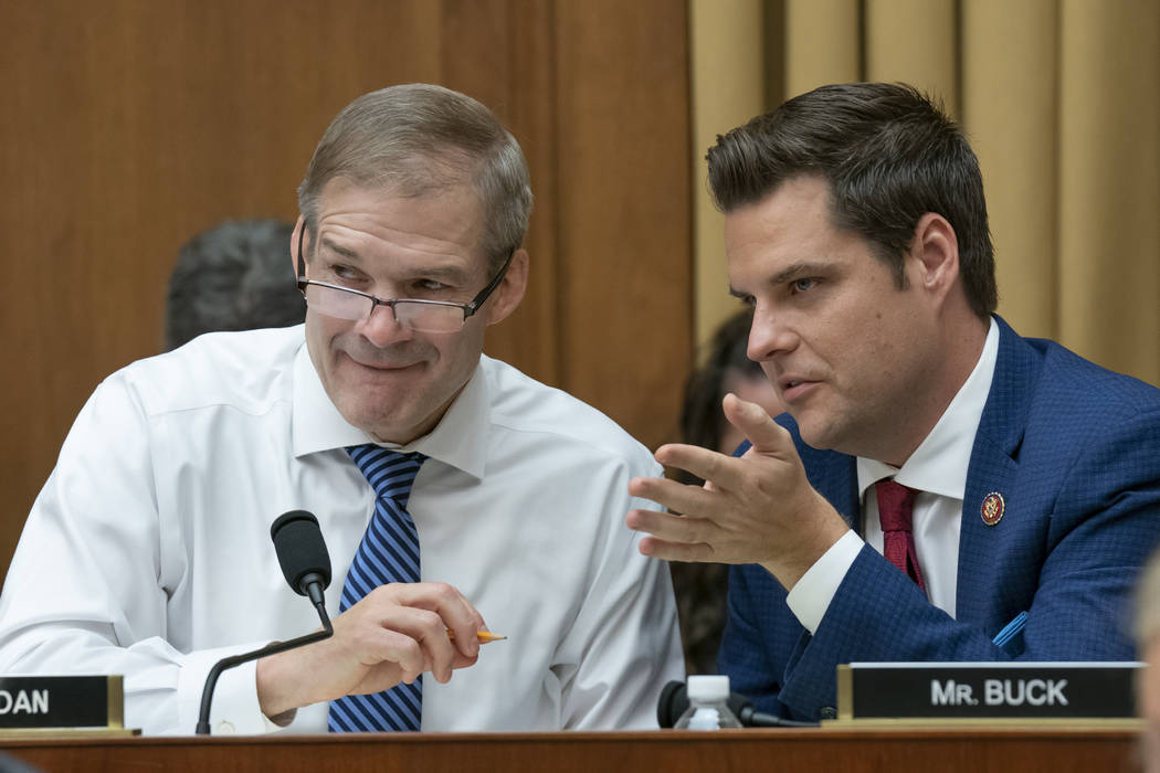 Rep. Jim Jordan, R-Ohio, left, and TALKS with Rep. Matt Gaetz, R-Fla., right, as former special ...