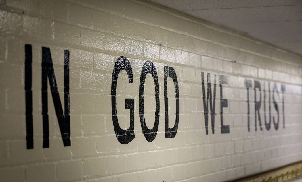 This July 23, 2019 photo shows "In God We Trust" stenciled in a wall at South Park Elementary i ...