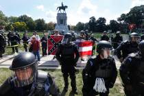 FILE - In this Sept. 16, 2017 file photo, State Police keep a small group of Confederate protes ...