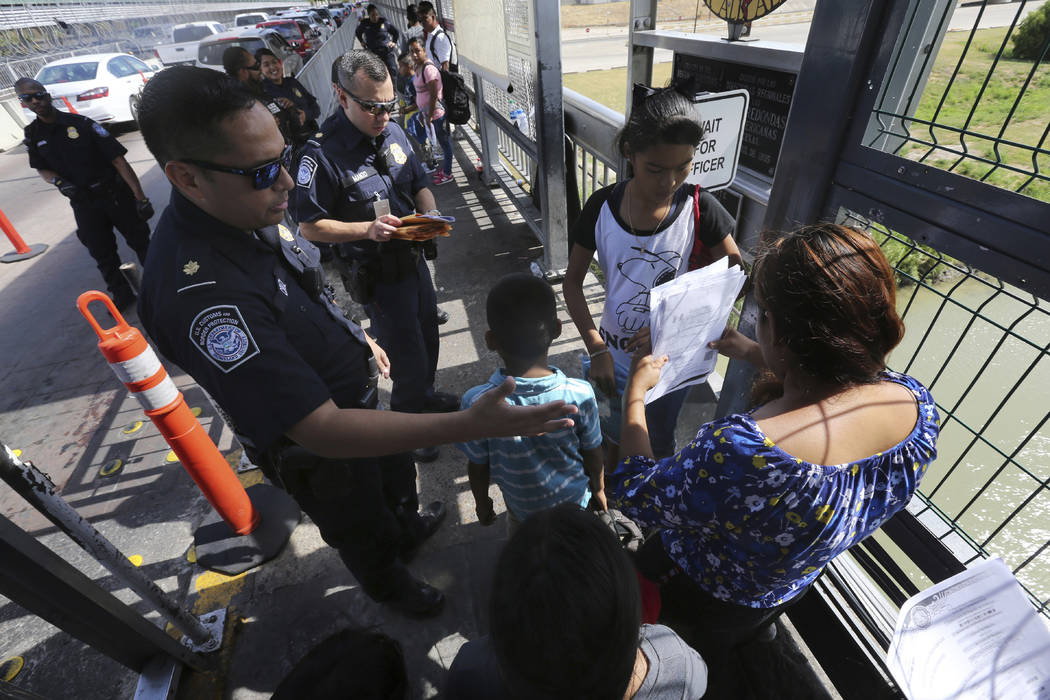 In a July 17, 2019, file photo, a United States Customs and Border Protection Officer checks th ...