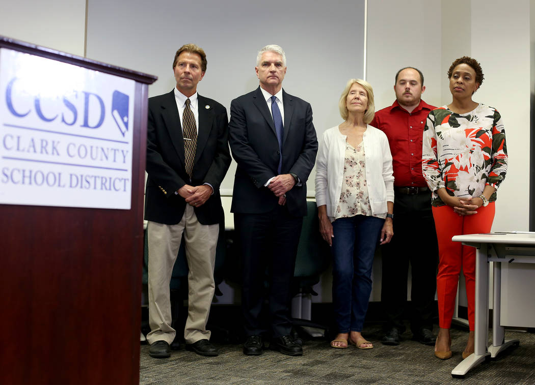 Staff listen as Clark County School Superintendent Dr. Jesus Jara speaks to the media at a pres ...