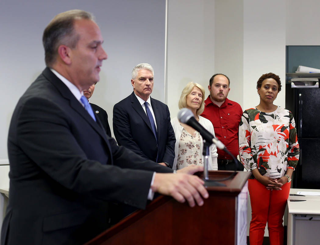 Staff listen as Clark County School Superintendent Dr. Jesus Jara speaks to the media at a pres ...