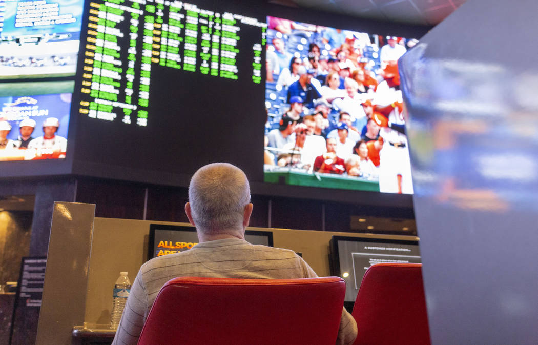 Bettors watch live sports at the CG Technology sportsbook at the Palms in Las Vegas, Thursday, ...