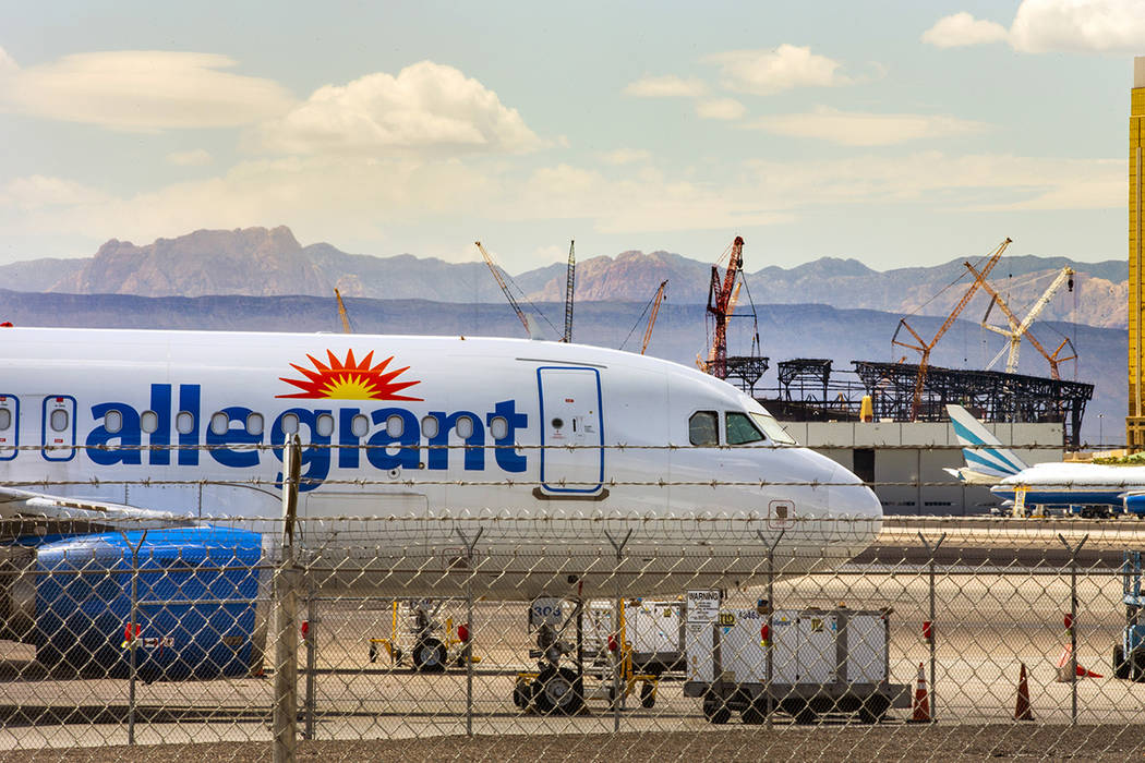 A Las Vegas-based Allegiant Air plane sits on the tarmac at McCarran International Airport with ...