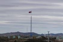 FILE - In this April 27, 2018, file photo, a North Korean flag flutters in the wind atop a 160- ...