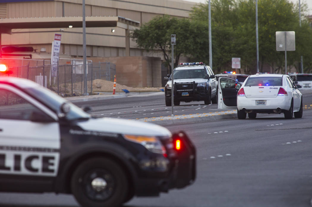 Las Vegas police respond to a barricade situation near Fort Apache and Russell roads in Las Veg ...