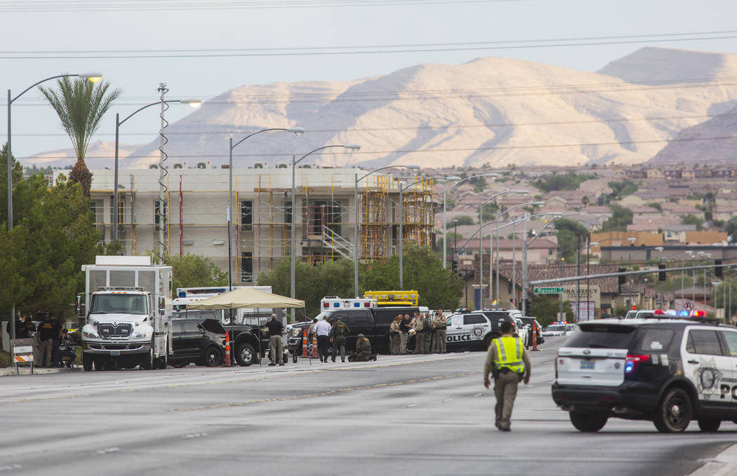 Las Vegas police respond to a barricade situation near Fort Apache and Russell roads in Las Veg ...