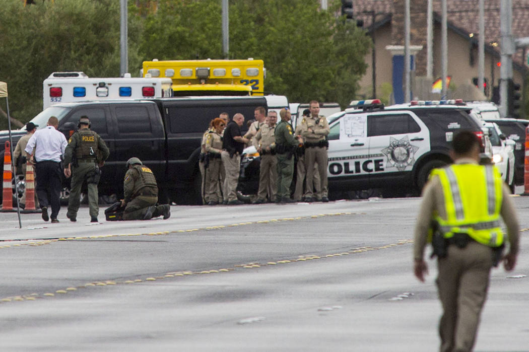 Las Vegas police respond to a barricade situation near Fort Apache and Russell roads in Las Veg ...