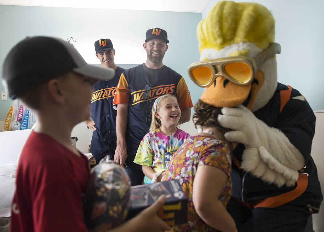 Las Vegas Aviators mascot Spruce the Goose, top/right, and Aviators pitchers Ben Bracewell and ...