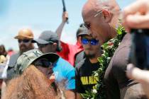 Actor Dwayne "The Rock" Johnson, right, is greeted by community leader Pua Case durin ...