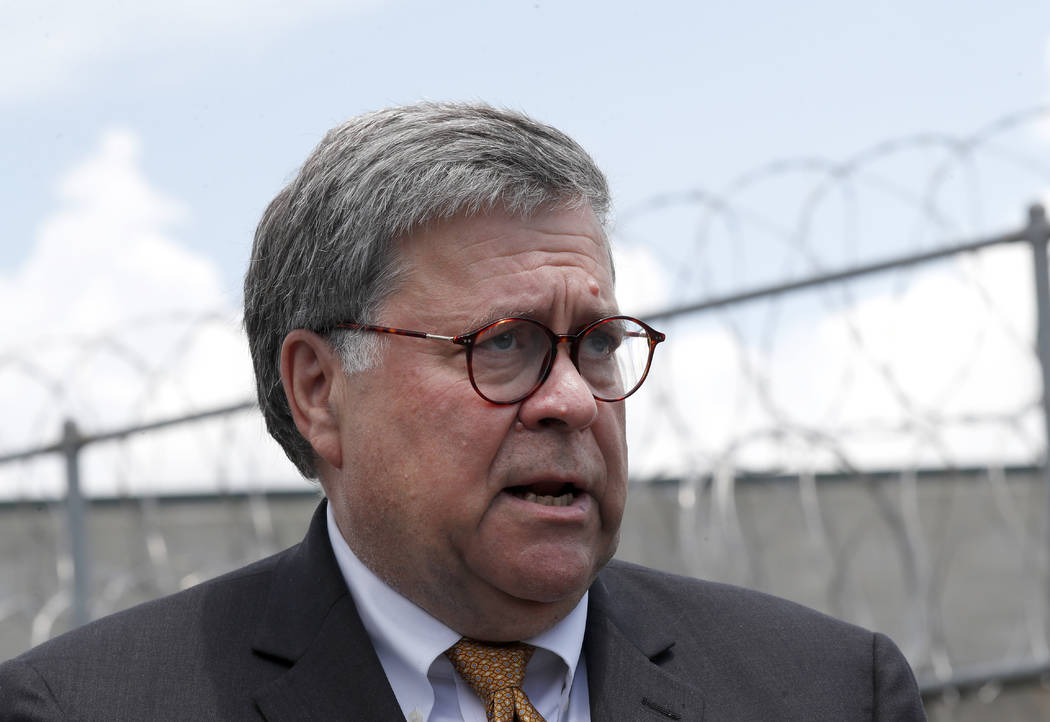 Attorney General William Barr speaks to reporters after a tour of a federal prison on July 8, 2 ...