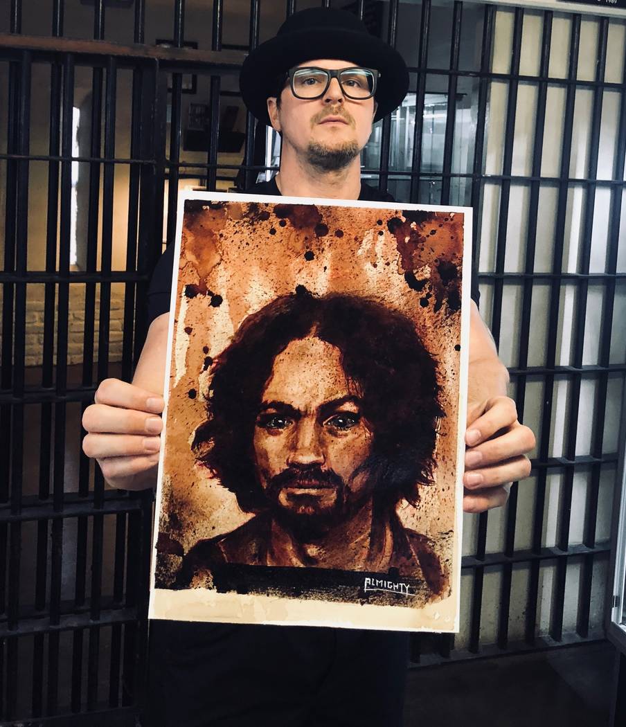 Zak Bagans of "Ghost Adventurers" on Travel Channel shows a painting of Charles Manson, with Ma ...