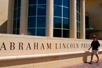 FILE - In this July 8, 2003 file photo, a young boy walks past the Abraham Lincoln Presidential ...
