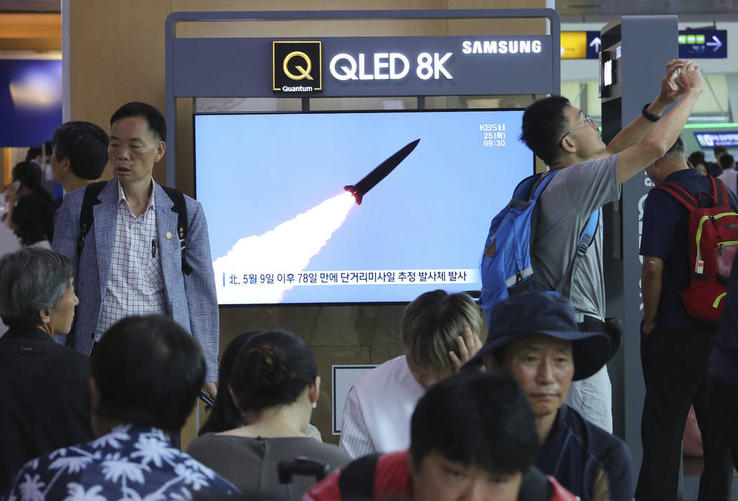 A TV screen shows a file image of North Korea's missile launch during a news program at the Seo ...