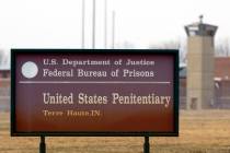 In a March 17, 2003, file photo, the guard tower flanks the sign at the entrance to the U.S. Pe ...