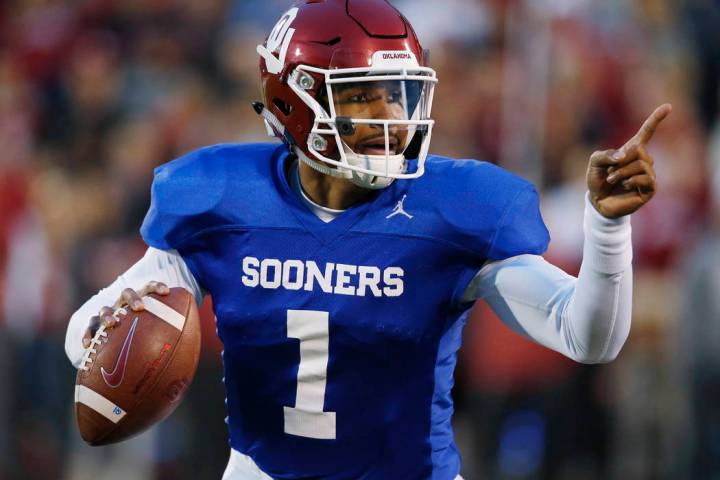 Oklahoma quarterback Jalen Hurts gestures during the NCAA college football team's spring game i ...