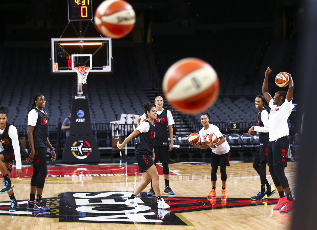 Members of Team Delle Donne shoot half-court shots while practicing ahead of the WNBA All-Star ...