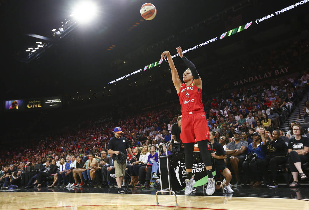 Las Vegas Aces' Kayla McBride competes in the three-point shooting challenge during the WNBA Al ...