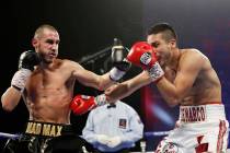 Maxim Dadashev of Russia, left, hits Antonio DeMarco of Mexico during a junior welterweight bou ...
