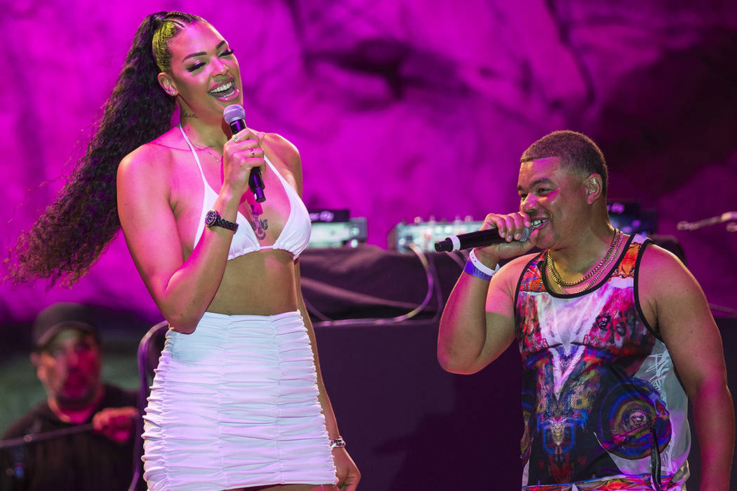 Las Vegas Aces center Liz Cambage, left, briefly walks on stage at Mandalay Bay Beach on Friday ...