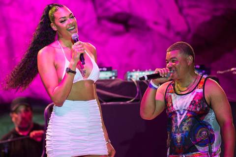 Las Vegas Aces center Liz Cambage, left, briefly walks on stage at Mandalay Bay Beach on Friday ...