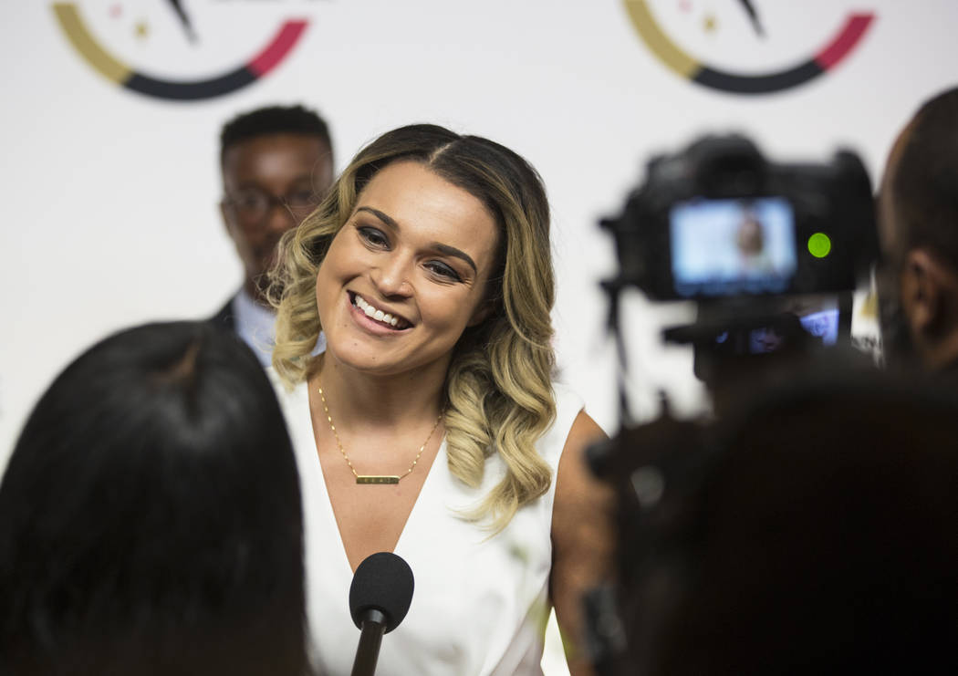 Las Vegas Aces guard Kayla McBride talks to the media on the WNBA Orange Carpet outside Della's ...