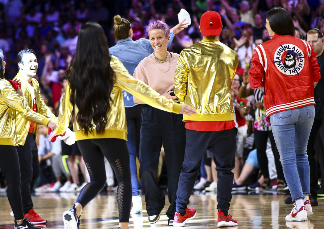 Soccer star Megan Rapinoe throws t-shirts to the crowd during the second half of the WNBA All-S ...