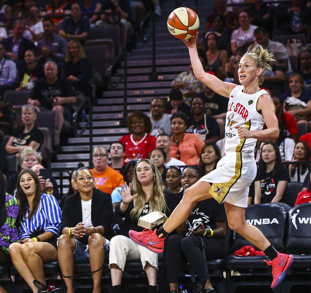 Chicago Sky's Courtney Vandersloot jumps to keep the ball in during the second half of the WNBA ...
