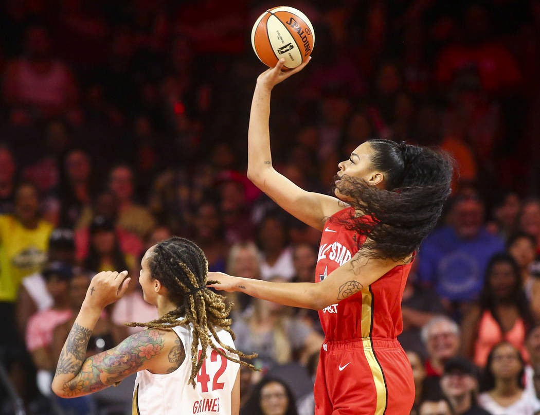 Las Vegas Aces' Liz Cambage shoots over Phoenix Mercury's Brittney Griner (42) during the first ...