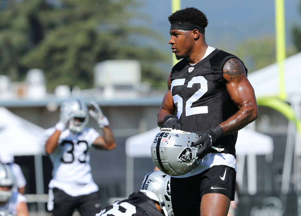 Oakland Raiders middle linebacker Marquel Lee (52) prepares to stretch during the NFL team's tr ...